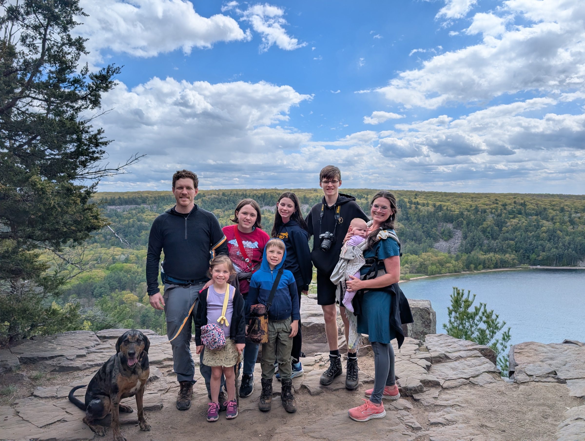 Family standing together at a scenic overlook
